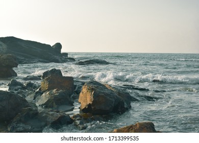 A Sea Side Rocks With The Waves Of Water. A Beautiful And Calm Sea Side Scenario.  