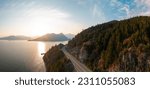 Sea to Sky Highway on Pacific Ocean West Coast. Aerial Panorama. Sunny Colorful Sunset. Located in Howe Sound between Vancouver and Squamish, British Columbia, Canada.