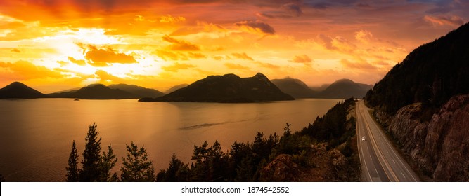 Sea to Sky Hwy in Howe Sound near Horseshoe Bay, West Vancouver, British Columbia, Canada. Aerial panoramic view. Dramatic Colorful Sunset Sky with Sunrays - Powered by Shutterstock