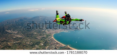 Sea skydive background. Man jumps with parashute 