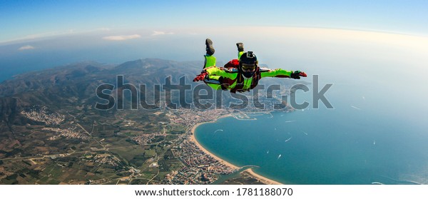 Sea skydive\
background. Man jumps with parashute\
