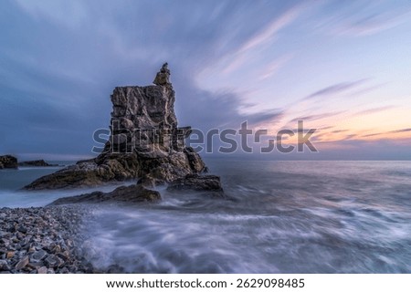 The Sea Stack Rock Formation at Dalian's Coast during sunset