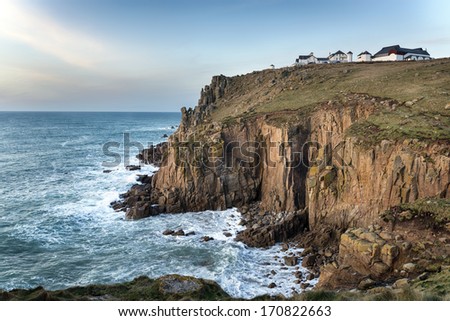 Sea and steep rugged cliffs at Lands End in Cornwall