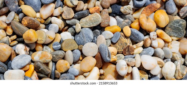 Sea stone pebble background. Abstract nature background with pebble stones. Full frame shot of multicolored pebbles. Close-up. Top view - Powered by Shutterstock