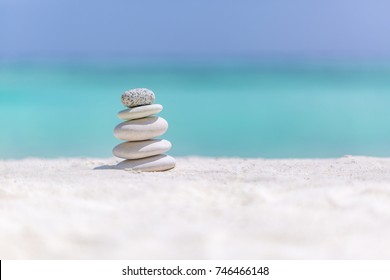 Sea stones balance and wellness retro spa concept, inspiration, zen like and well being tranquil composition. Close-up of zen stones at the beach - Powered by Shutterstock