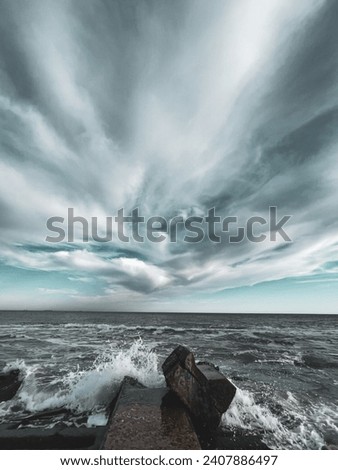 Sea storm waves in cloudy day