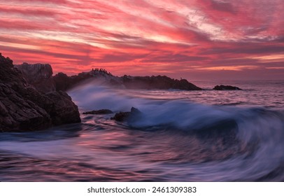 Sea surf at sunset. Sunset sea surf. The waves of the sea surf at sunset. Coastal sea rocks at sunset - Powered by Shutterstock