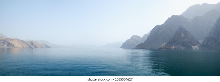 Sea tropical landscape with mountains and fjords, Oman. Vacation recreation holiday travel adventure concept. 