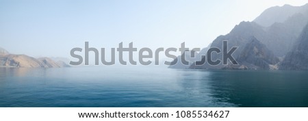 Sea tropical landscape with mountains and fjords, Oman. Vacation recreation holiday travel adventure concept. 