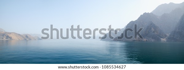 Sea\
tropical landscape with mountains and fjords, Oman. Vacation\
recreation holiday travel adventure concept.\
