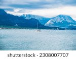 Sea view on a yaht and mountains, magical Turkey. White yaht and cloudy mountains, view from the sea. Travel or Vacation background.