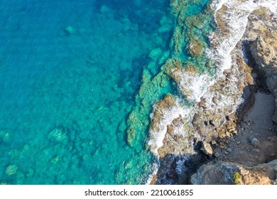 The sea view, the rocks on the beach with turquoise sea water.