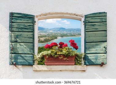 Sea view through the open window with flowers in Italy