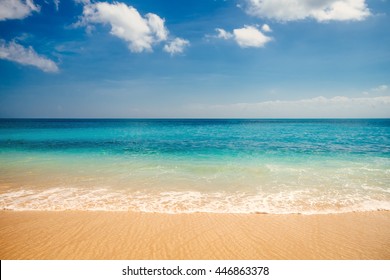 Sea view from tropical beach with sunny sky. Summer paradise beach of Bali island. Tropical shore. Tropical sea in Bali. Exotic summer beach with clouds on horizon. Ocean beach relax, outdoor travel - Powered by Shutterstock