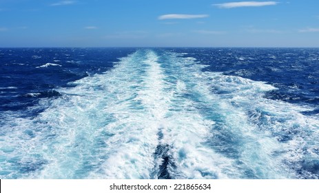 Sea wake behind large ship