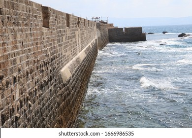 Sea Wall Of Old City Acre In A Winter Evening.