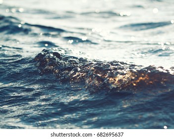 sea wave closeup, low angle view, vintage color effect