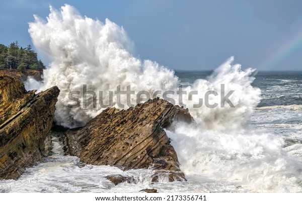 Sea waves break on coastal rocks. Waves\
break on rocks. Sea surf. Sea waves of sea\
surf