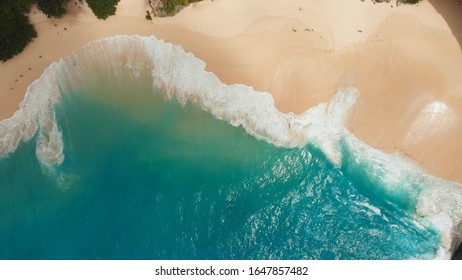 Sea waves Kelingking beach in Nusa Penida island, Bali, Indonesia. Drone view close up. - Shutterstock ID 1647857482