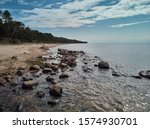 Sea waves lash line impact rock on the beach