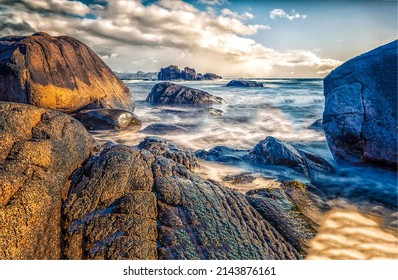 Sea waves near the rocky shore. Boulders beach at sea. Sea boulders beach. Boulders seaview