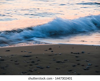 Sea waves in sunrise light