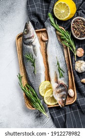 Seabass Fish With Herbs, Raw Sea Bass. Gray Background. Top View