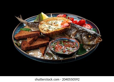 Seabass With Spinach And Cream Sauce. On A Black Background