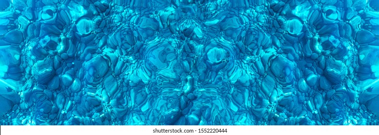 Seabed with pebbles through clear blue water, banner. Abstract blue background. Texture of the seabed, panorama. Surface of the seabed.