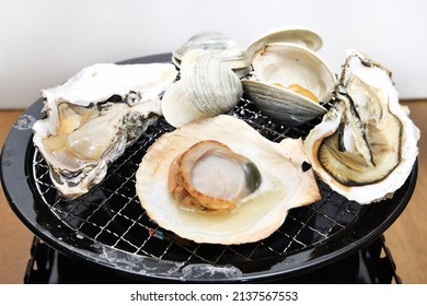 Seafood barbecue grilling shellfish on the net