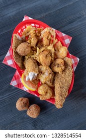 Seafood Basket With Fried Shrimp, Fish, And Hush Puppies Flat Lay