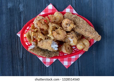 Seafood Basket With Fried Shrimp, Fish, And Hush Puppies Flat Lay