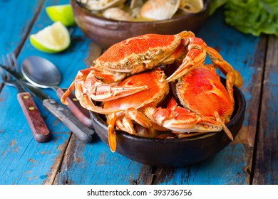 Seafood. Bowl of crabs and soup of slams on wooden blue background. Traditional food on Holy week Easter in Latin America.  - Powered by Shutterstock