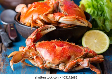 Seafood. Crabs in clay bowl on wooden blue background - Powered by Shutterstock