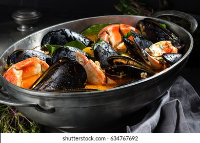 Seafood. Crabs with mussel in metal pot. Mariscal or paila marina. Seafood shellfish soup with musssels and crabs