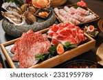 Seafood cuisine plate and beef sliced meat for hot pots. pork slices, scallops,  seashells, oysters, caviar and other seafood delicacies.