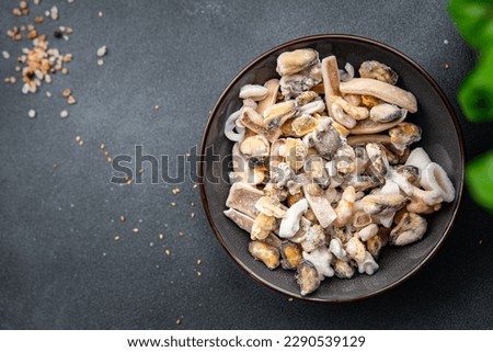 seafood frozen food Seafood Cocktail mussels, rapan, octopus, scallop, squid healthy meal food snack on the table copy space food background rustic top view pescatarian diet