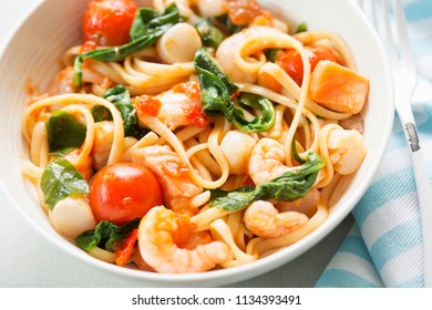 Seafood Linguine With Prawns, Scallops And Salmon, Spinach And Tomatoes