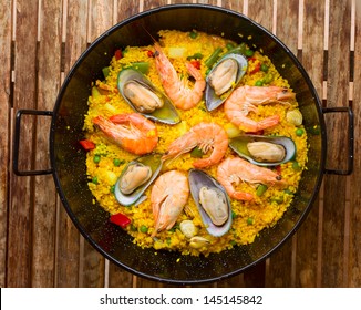 Seafood Paella in black pan  -traditional spanish rice dish