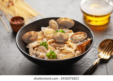 Seafood pasta with clams. Spaghetti alle Vongole on a light background. - Powered by Shutterstock