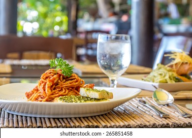 Seafood Pasta In Tomato Sauce Served In A Small Outdoor Restaurant, Meal Time