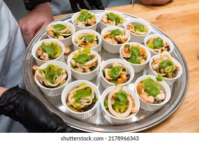 Seafood With Pesto Sauce In Ramekins On A Metal Tray. Lots Of Portions.