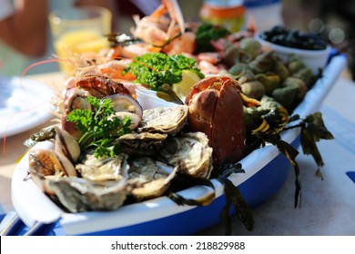 Seafood Plate With Crab, Prawns, Shrimps And Oysters Served In Traditional Beach Restaurant At North Sea, France Or Belgium