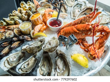 Seafood Plate. Different Molluscs And Crustaceans Lay Over Ice.