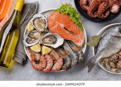 Seafood Platter Delight: Shrimps, Salmon, Oysters Galore. Flat lay with wine bottle - Powered by Shutterstock