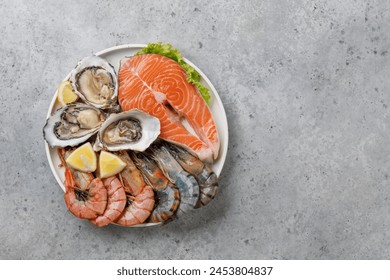 Seafood Platter Delight: Shrimps, Salmon, Oysters Galore. Flat lay with copy space - Powered by Shutterstock