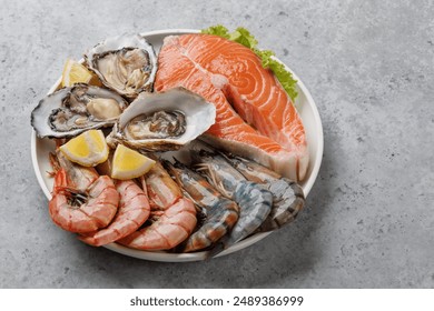 Seafood Platter Delight: Shrimps, Salmon, Oysters Galore. With copy space - Powered by Shutterstock