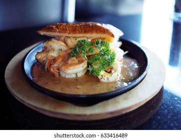 Seafood Pot Pie; Shrimp, Hokkaido Scallop And Squid In Bechamel Sauce Stir With Carrot Served In Black Hot Flat Pan With Flaky Puff Pastry Crust, French Food