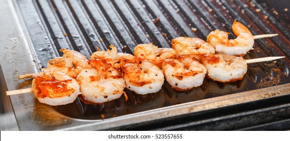 Seafood shrimp prawn threaded on wooden skewers. Shrimps is kind of seafood mostly used all over the world, special Mediterranean region, Europe, Thai, China and Australia region, USA, Canada.