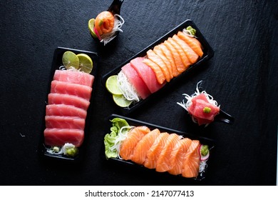Seafood that is cut into pieces, consisting of salmon, tuna, called sashimi by Sci SUN